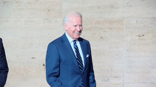 Man In Suit And Tie Fist Raised GIF