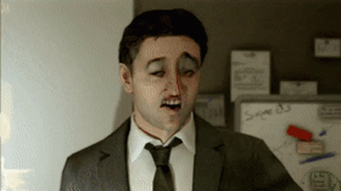 A Man In A Suit And Tie Is Standing In Front Of A Whiteboard That Says Sage 83 GIF