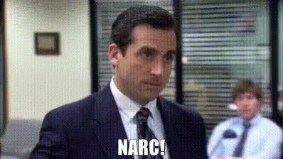 A Man In A Suit And Tie Is Standing In Front Of A Window In An Office . GIF