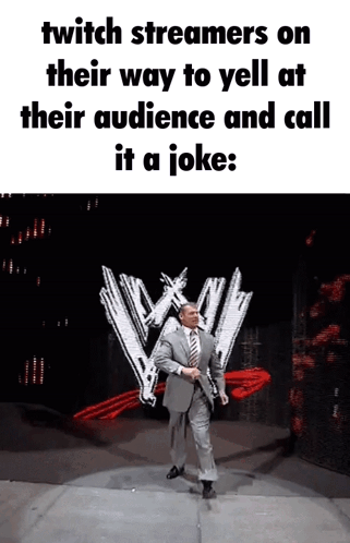 A Man In A Suit And Tie Is Standing In Front Of A Wwe Logo GIF
