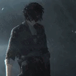 A Man In A Suit And Tie Is Standing In The Dark Holding A Gun . GIF