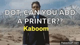 A Man In A Suit And Tie Is Standing In The Desert With The Words " Dot Can You Add A Printer ? " GIF