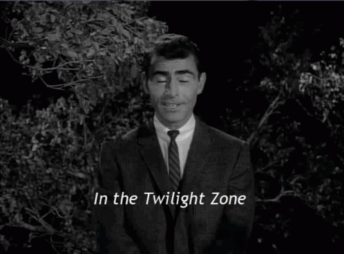 A Man In A Suit And Tie Is Standing In The Twilight Zone . GIF