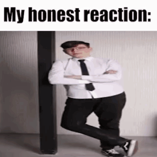 A Man In A Suit And Tie Is Standing Next To A Pole With His Arms Crossed . GIF