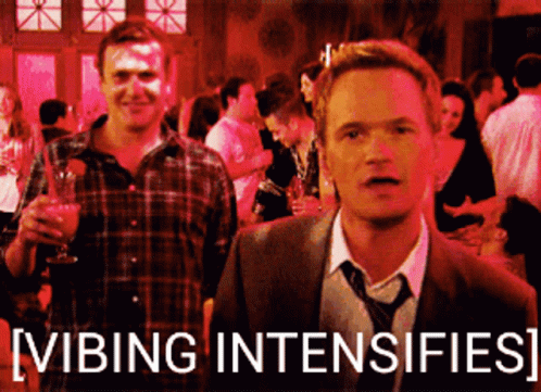 A Man In A Suit And Tie Is Standing Next To Another Man In A Plaid Shirt With The Words Vibing Intensifies GIF
