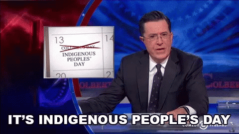 A Man In A Suit And Tie Is Talking About Indigenous Peoples ' Day GIF