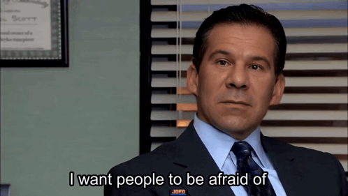 A Man In A Suit And Tie Is Talking About People GIF