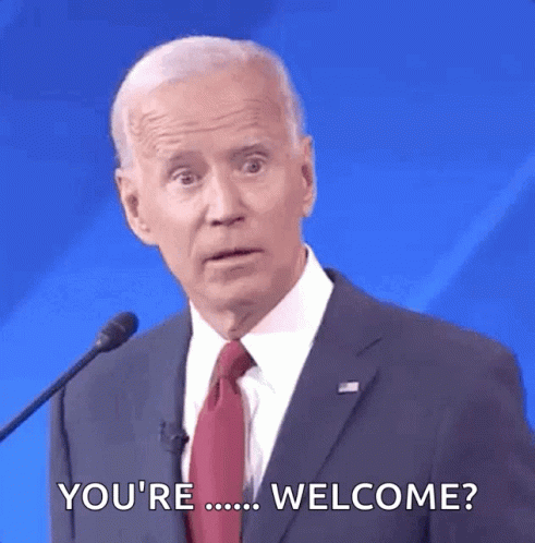 Man In Suit Talking Into Microphone Says You Welcome GIF