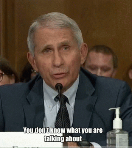 A Man In A Suit And Tie Is Talking Into A Microphone With The Words " You Don 'T Know What You Are Talking About " GIF