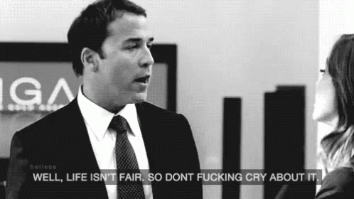 A Man In A Suit And Tie Is Talking To A Woman In A Black And White Photo . GIF