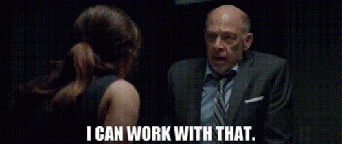 A Man In A Suit And Tie Is Talking To A Woman In A Black Dress And Says `` I Can Work With That '' . GIF