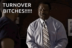 A Man In A Suit And Tie Is Talking To Another Man And Says `` Turnover Bitches '' . GIF