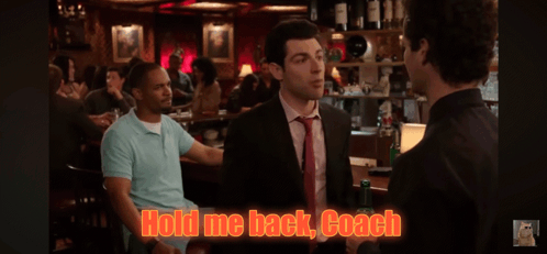 A Man In A Suit And Tie Is Talking To Another Man In A Bar With The Words Hold Me Back Coach Written On The Screen GIF