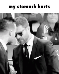 A Man In A Suit And Tie Is Talking To Another Man In A Black And White Photo . GIF