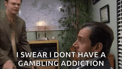 A Man In A Suit And Tie Is Talking To Another Man In A Suit And Tie In A Room . GIF