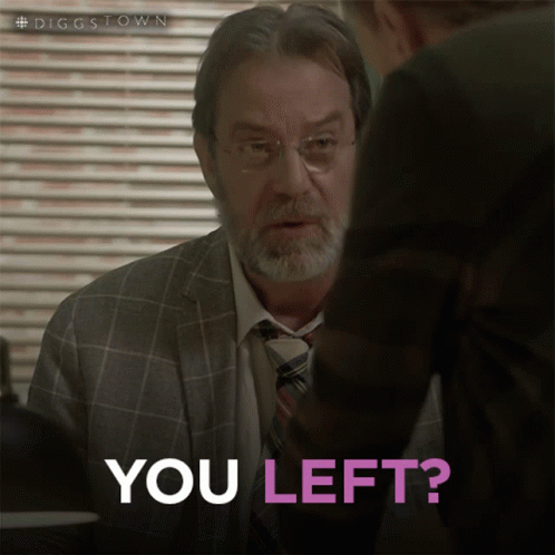 A Man In A Suit And Tie Is Talking To Another Man Who Is Asking If He Left GIF