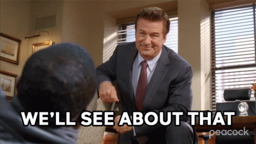 A Man In A Suit And Tie Is Talking To Another Man With The Words " We 'Ll See About That " Below Him GIF