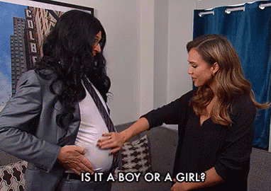 A Man In A Suit And Tie Is Touching A Pregnant Woman 'S Belly And Asking If It Is A Boy Or Girl GIF