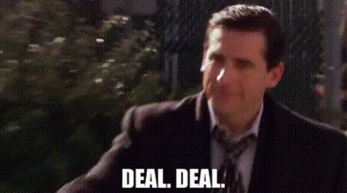 A Man In A Suit And Tie Is Walking Down A Street And Says `` Deal , Deal '' . GIF