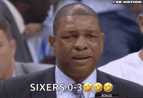 A Man In A Suit And Tie Is Watching A Basketball Game And Says Sixers 0-3 Bonus GIF