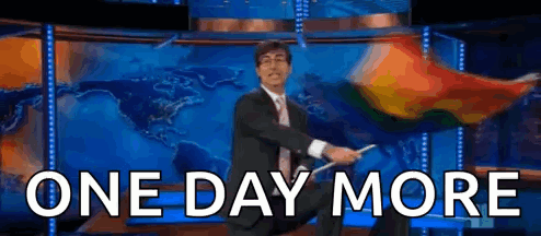 A Man In A Suit And Tie Is Waving A Flag In Front Of A Map And The Words One Day More GIF