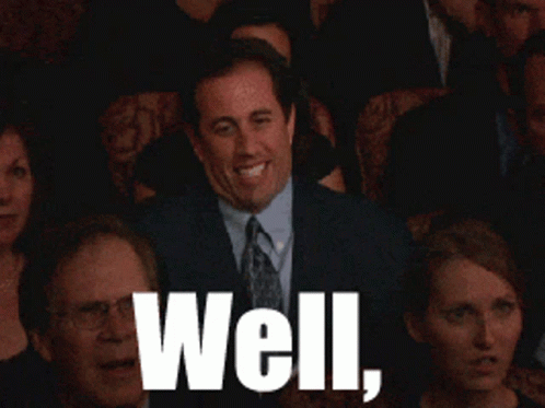 A Man In A Suit And Tie Is Waving In Front Of A Crowd With The Words Well Written In White GIF