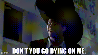a man in a suit and tie is wearing a cowboy hat and saying " don 't you go dying on me "
