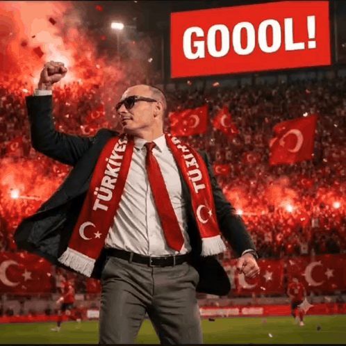 a man in a suit and tie is wearing a scarf that says turkey