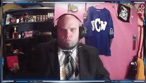 a man in a suit and tie is wearing headphones and a shirt that says tcw on it