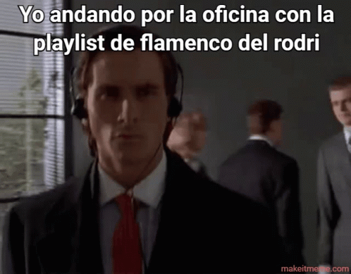 A Man In A Suit And Tie Is Wearing Headphones With The Caption Yo Andando Por La Oficina GIF
