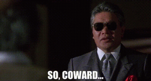 A Man In A Suit And Tie Is Wearing Sunglasses And Saying `` So , Coward . '' GIF