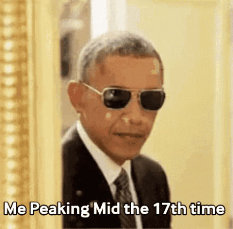 A Man In A Suit And Tie Is Wearing Sunglasses And Says " Me Peaking Mid The 17Th Time " GIF
