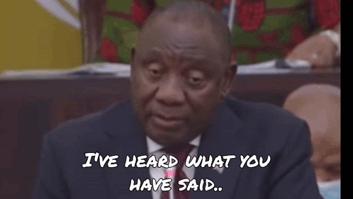A Man In A Suit And Tie Is Wearing Sunglasses With The Word Fokol Written On The Bottom GIF