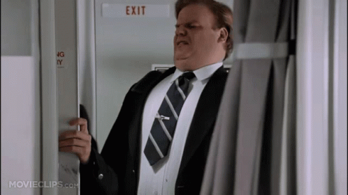 A Man In A Suit And Tie Opens An Exit Door GIF
