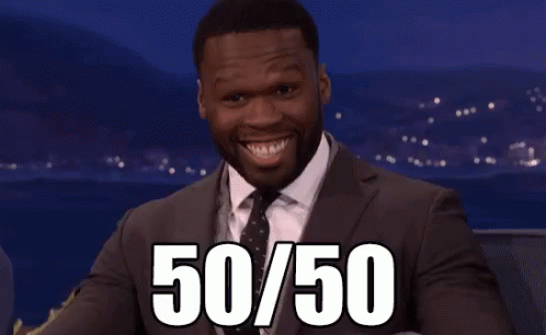 A Man In A Suit And Tie Points At The Number 50 GIF