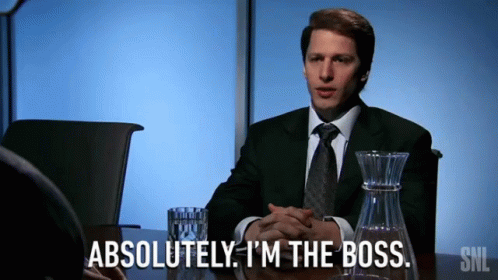 a man in a suit and tie says absolutely i 'm the boss while sitting at a table