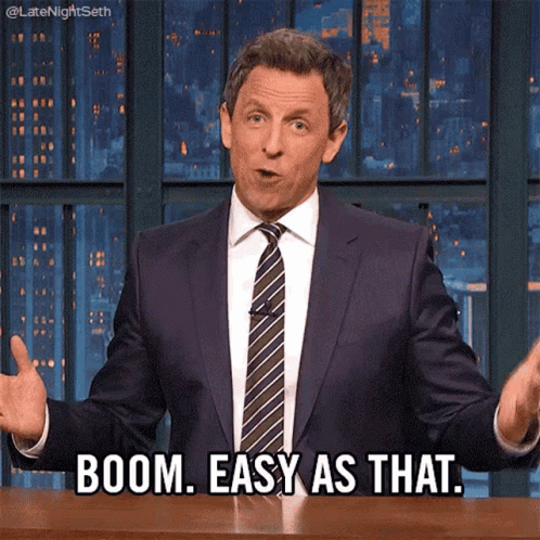 A Man In A Suit And Tie Says Boom Easy As That .. GIF