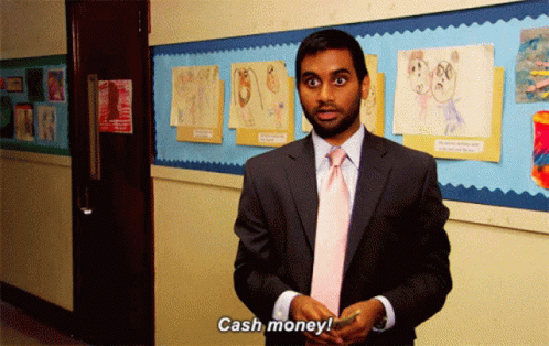 A Man In A Suit And Tie Says Cash Money In A Hallway GIF