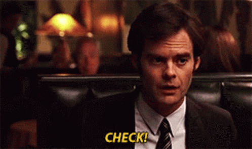 A Man In A Suit And Tie Says Check In Yellow Letters GIF