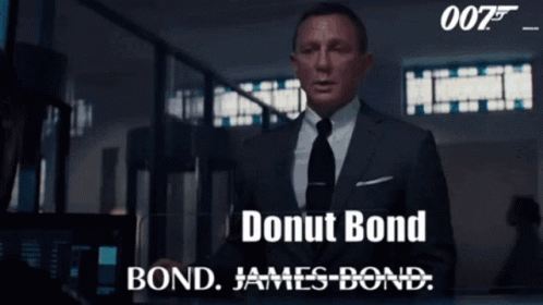 A Man In A Suit And Tie Says Donut Bond Bond James-Bond GIF