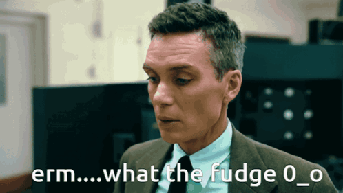 A Man In A Suit And Tie Says Erm What The Fudge 0_0 GIF