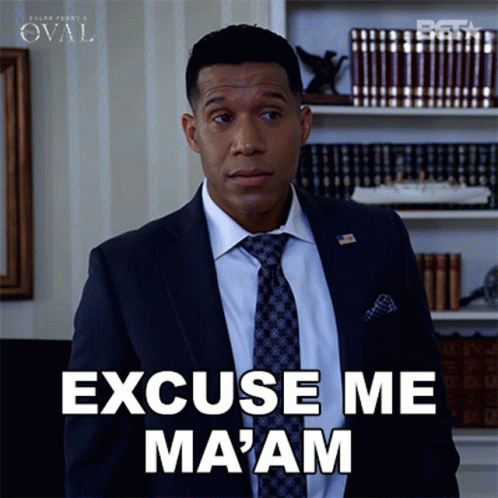 A Man In A Suit And Tie Says " Excuse Me Ma 'Am " GIF