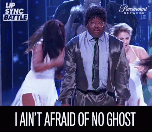 A Man In A Suit And Tie Says I Ain 'T Afraid Of No Ghost While Dancing GIF