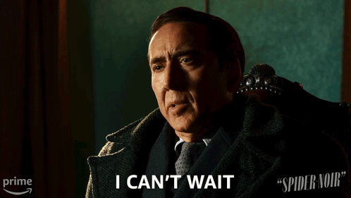 A Man In A Suit And Tie Says " I Can 'T Wait " While Sitting In A Chair GIF