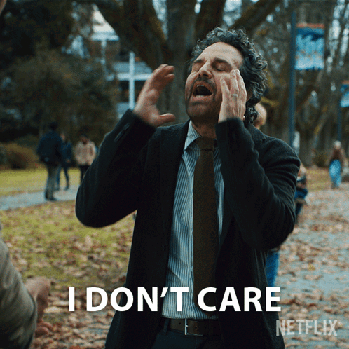 A Man In A Suit And Tie Says I Do N't Care Netflix GIF