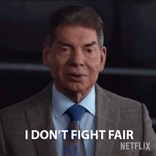A Man In A Suit And Tie Says I Don T Fight Fair GIF