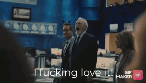 a man in a suit and tie says " i fucking love it "
