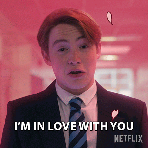 A Man In A Suit And Tie Says I 'M In Love With You Netflix GIF