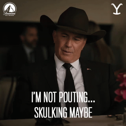 A Man In A Suit And Tie Says I 'M Not Pouting ... Skullking Maybe GIF