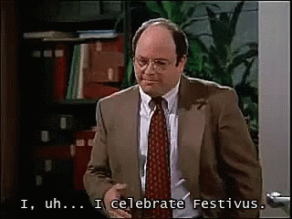 A Man In A Suit And Tie Says I Uh ... I Celebrate Festivus GIF